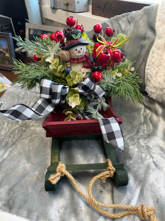 14 inch Christmas sled full of Christmas folage