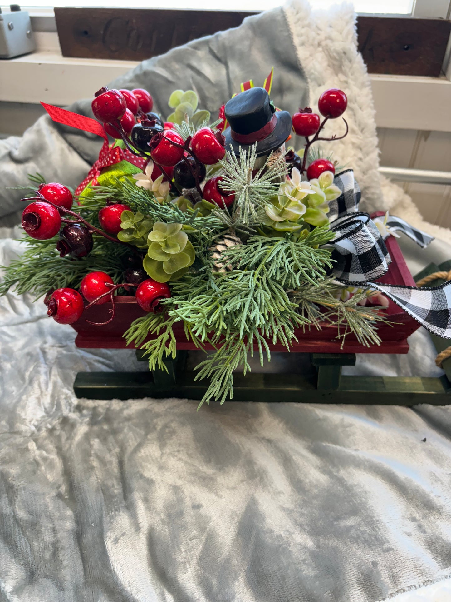 14 inch Christmas sled full of Christmas folage